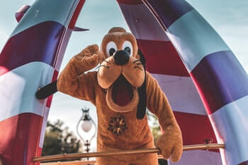 Disney's Pluto character standing and waving.